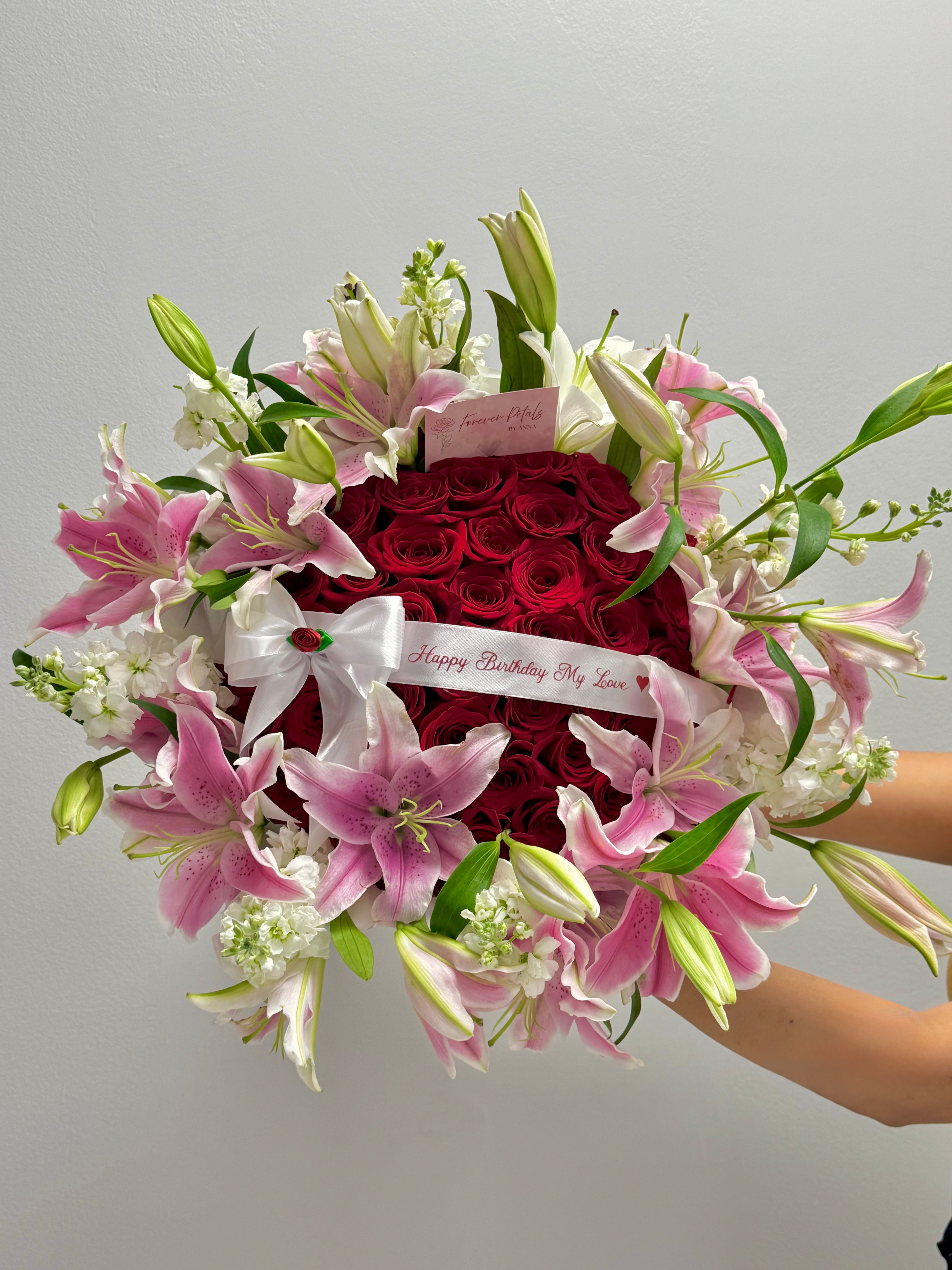 Luxury 50 Red Roses Bouquet + Lilies Rim – “Happy Birthday My Love” Edition