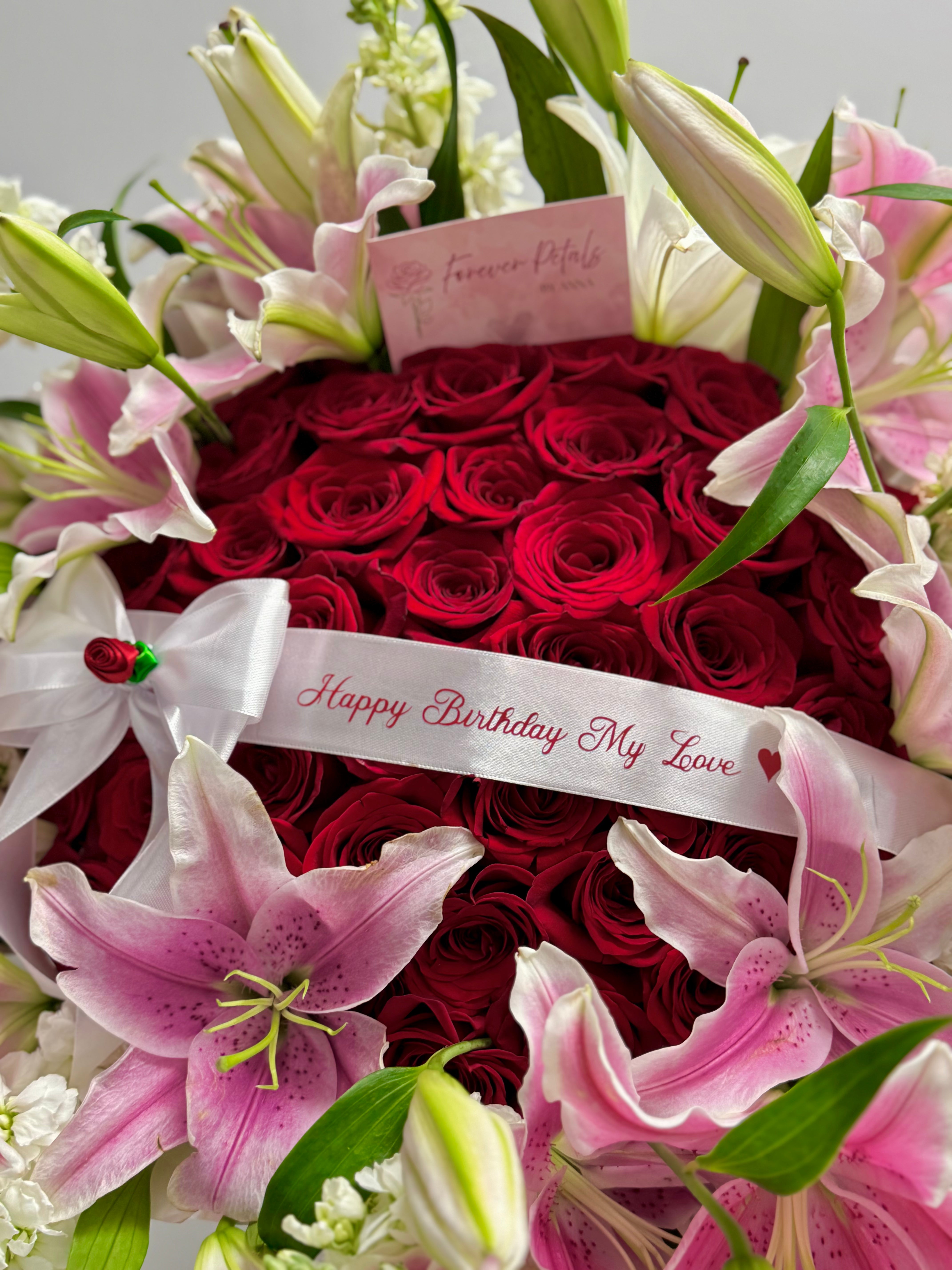 Luxury 50 Red Roses Bouquet + Lilies Rim – “Happy Birthday My Love” Edition